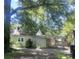 Back exterior view showcasing a covered area and fenced yard, offering space for outdoor enjoyment at 237 Institute St, Mooresville, NC 28115