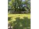 The spacious backyard is enclosed with a chain-link fence at 237 Institute St, Mooresville, NC 28115