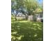 Large backyard features mature shade trees, a fence, and an air conditioning unit at 237 Institute St, Mooresville, NC 28115
