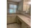 Bright bathroom featuring a long vanity countertop and cabinet storage at 237 Institute St, Mooresville, NC 28115