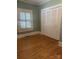 Comfortable bedroom with ample closet space and natural light streaming through the windows at 237 Institute St, Mooresville, NC 28115