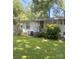 Exterior with large front yard, shade trees and a view of the back side of the house at 237 Institute St, Mooresville, NC 28115