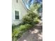 Side exterior view featuring well-kept landscaping and white siding, complemented by a clean driveway at 237 Institute St, Mooresville, NC 28115