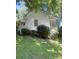 Exterior view of the home with well-maintained lawn and mature landscaping, showcasing classic charm at 237 Institute St, Mooresville, NC 28115