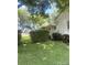 Side exterior featuring a well-manicured lawn and mature shrubbery, providing a private and serene setting at 237 Institute St, Mooresville, NC 28115
