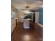 Modern kitchen features an island, natural wood cabinets, granite countertops, and hardwood floors at 237 Institute St, Mooresville, NC 28115