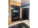 Close up on stainless steel built-in oven and stove top with stylish granite countertops at 237 Institute St, Mooresville, NC 28115