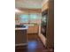 Updated kitchen showcases stainless steel appliances, a farmhouse sink, and ample cabinet space at 237 Institute St, Mooresville, NC 28115