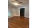 Inviting living room featuring hardwood floors, neutral walls, and natural light from the windows at 237 Institute St, Mooresville, NC 28115