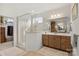 Bathroom featuring a walk-in shower, a double sink vanity, and tiled floors at 2399 Ashbourne Se Pl, Concord, NC 28025