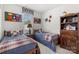 Comfortable bedroom with twin beds, wood furniture, and natural light at 2399 Ashbourne Se Pl, Concord, NC 28025