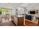 Open kitchen with modern appliances, granite countertops, and seamless flow to living spaces at 2399 Ashbourne Se Pl, Concord, NC 28025