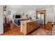 Bright kitchen with modern appliances, a breakfast bar, and seamless flow to living spaces at 2399 Ashbourne Se Pl, Concord, NC 28025