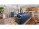 Open-concept living room with hardwood floors and comfortable seating, perfect for entertaining at 2399 Ashbourne Se Pl, Concord, NC 28025