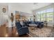 Bright living room with hardwood floors and an open concept layout with lots of natural light at 2399 Ashbourne Se Pl, Concord, NC 28025