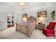 Beautiful main bedroom features neutral carpet, tan walls, and an elegant bed frame at 2399 Ashbourne Se Pl, Concord, NC 28025