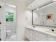 This bathroom offers white cabinets, marble countertops, and double sinks at 2432 Hartmill Ct, Charlotte, NC 28226