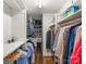This walk-in closet offers shelving and hanging racks for storage, along with hardwood floors at 2432 Hartmill Ct, Charlotte, NC 28226