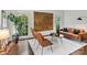 Cozy living room with hardwood floors, ample natural light, and stylish furniture at 2432 Hartmill Ct, Charlotte, NC 28226
