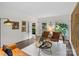 Bright living room featuring hardwood floors, neutral walls, and view of the outdoor greenery at 2432 Hartmill Ct, Charlotte, NC 28226