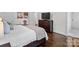 Spacious main bedroom with hardwood floors, a large bed, and neutral decor at 2432 Hartmill Ct, Charlotte, NC 28226