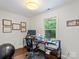Bright home office with natural light, modern furnishings, and visible wall decor at 2432 Hartmill Ct, Charlotte, NC 28226