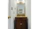 Bathroom featuring a vanity with marble countertop, decorative mirror, and antique-style fixtures at 2723 Craddock Ave, Charlotte, NC 28208