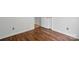 Bedroom featuring wood floors, light-colored walls, and ample electrical outlets for convenience at 2723 Craddock Ave, Charlotte, NC 28208