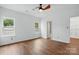 Light-filled bedroom with hardwood floors, large windows, and a ceiling fan at 2723 Craddock Ave, Charlotte, NC 28208