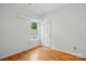 Neutral bedroom with light-colored walls, hardwood floors, and a window providing natural light at 2723 Craddock Ave, Charlotte, NC 28208