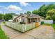 Exterior view showing the home's cozy front porch and adjacent parking at 2723 Craddock Ave, Charlotte, NC 28208