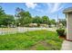 Exterior view showing the lawn with a charming white picket fence at 2723 Craddock Ave, Charlotte, NC 28208