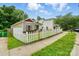 View of the home with white picket fence along the side of the lawn at 2723 Craddock Ave, Charlotte, NC 28208
