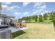 Spacious backyard features a patio area, a fenced yard, landscaping, and a lush green lawn at 2732 Berkhamstead Cir, Concord, NC 28027