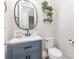 Charming half-bath with stylish vanity, modern fixtures and decorative plants on shelves at 2732 Berkhamstead Cir, Concord, NC 28027