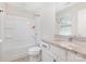 Bright bathroom features a shower and tub combination and granite countertop on the vanity at 2732 Berkhamstead Cir, Concord, NC 28027