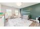 Inviting playroom with natural light, teepee, and cozy couch is perfect for  at 2732 Berkhamstead Cir, Concord, NC 28027