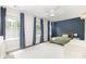 Bright bedroom with ample natural light, blue accent wall and plush carpet at 2732 Berkhamstead Cir, Concord, NC 28027