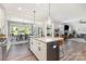 Open concept kitchen flows into a breakfast nook, living area, and an inviting living room at 2732 Berkhamstead Cir, Concord, NC 28027