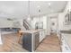 Bright, open kitchen with stainless steel appliances and island is ready for entertaining at 2732 Berkhamstead Cir, Concord, NC 28027