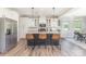 Modern kitchen with stainless steel appliances, white cabinets, and a central island with bar seating at 2732 Berkhamstead Cir, Concord, NC 28027
