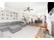Open-concept living room with hardwood floors, flowing to the kitchen and stairway at 2732 Berkhamstead Cir, Concord, NC 28027