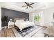 Elegant bedroom with tray ceiling, dark accent wall, and natural light creates a soothing retreat at 2732 Berkhamstead Cir, Concord, NC 28027