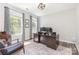 Bright office with natural light, wood floors, a modern desk, and stylish decor at 2732 Berkhamstead Cir, Concord, NC 28027