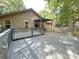 Spacious wooden deck perfect for entertaining, overlooking the backyard, and featuring a pergola at 3051 Dairy Farm Dr, Monroe, NC 28110