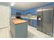 Stylish kitchen featuring blue cabinetry, stainless steel appliances, and an island at 3051 Dairy Farm Dr, Monroe, NC 28110