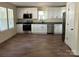 Modern kitchen with stainless steel appliances, granite countertops, and white cabinets at 307 Wilson St, Monroe, NC 28112