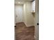 Charming mud room with wood-look flooring and white cabinets located near an exterior door at 307 Wilson St, Monroe, NC 28112