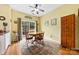 Bright dining area with wood floors, large window, and decorative rug underneath the table at 3247 Mannington Dr, Charlotte, NC 28270