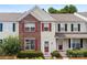 Charming townhome with brick facade, red shutters, and manicured landscaping at 3247 Mannington Dr, Charlotte, NC 28270
